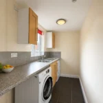 Shared utility/laundry room - serves Rooms 19-24